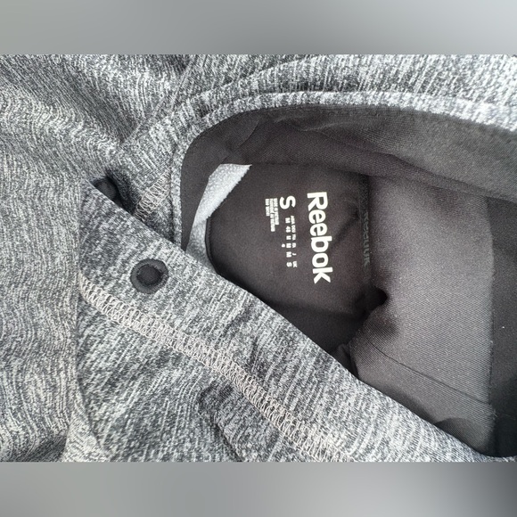 Reebok sweatshirt a little cut not through the item otherwise great condition! - Picture 2 of 4